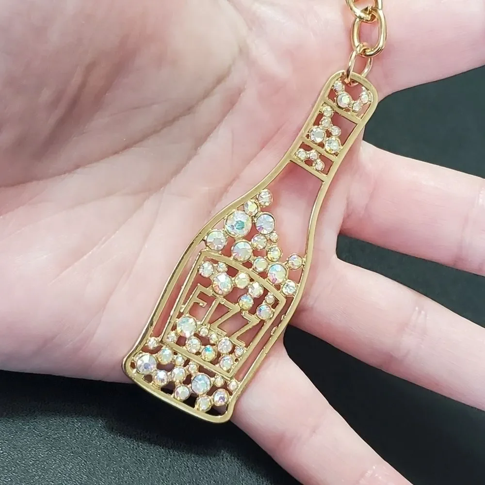 Gold tone Fizz bottle keychain